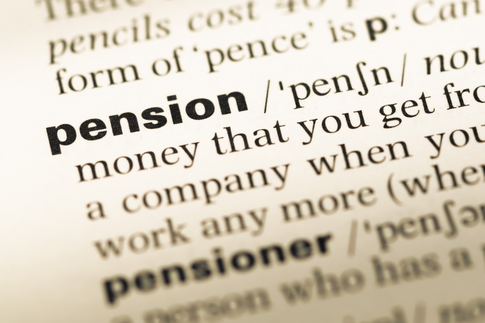 Close up of old English dictionary page with word pension