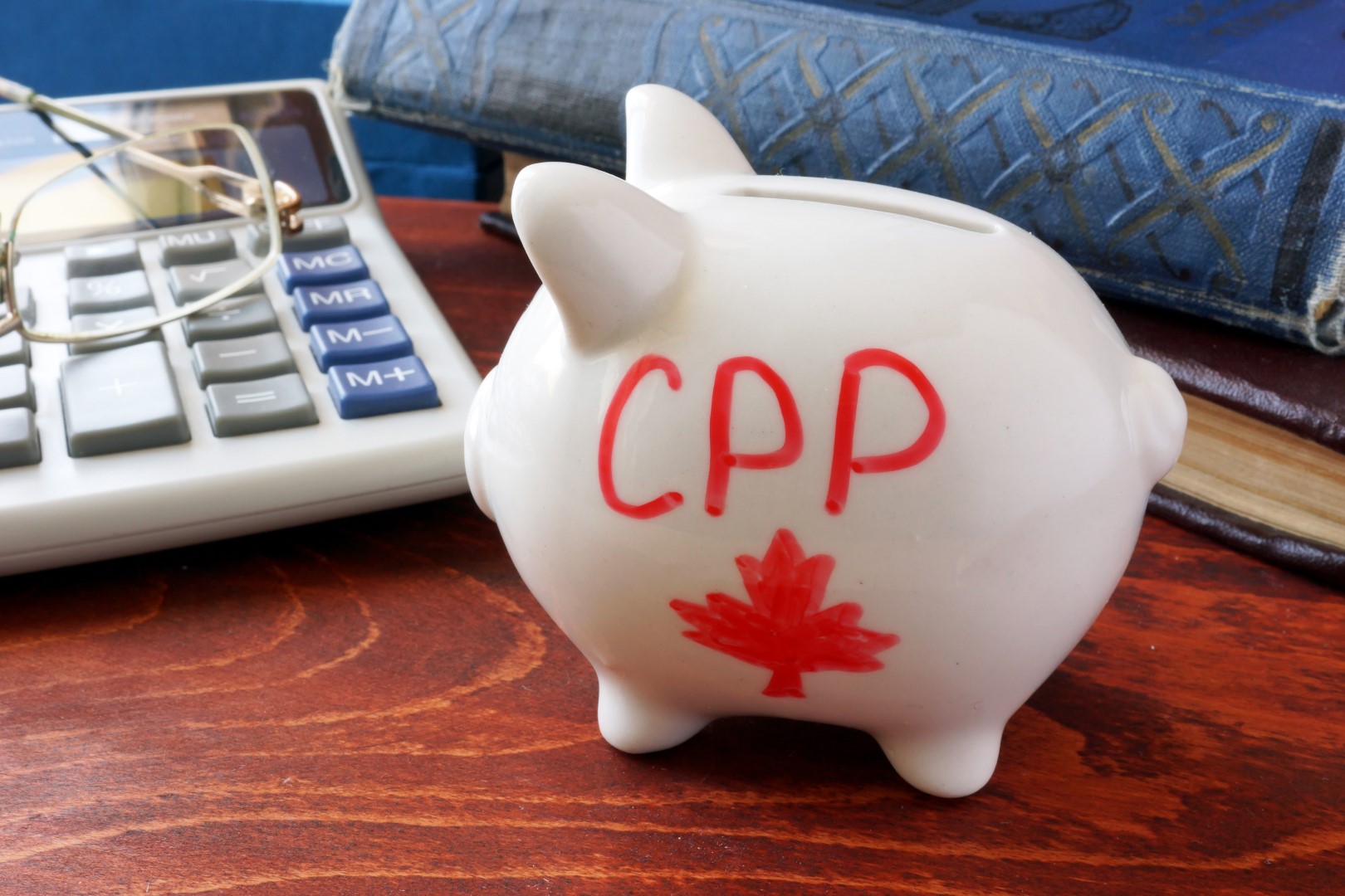 Piggy bank with word CPP. Canada Pension Plan concept.