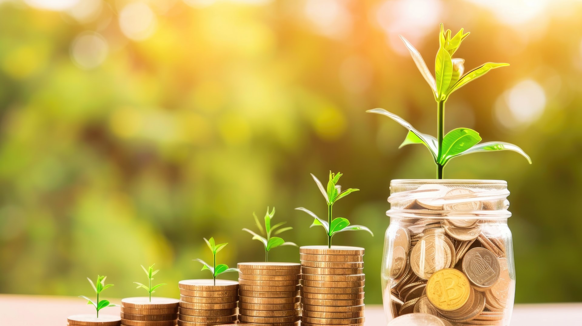 Three small plants growing in jars filled with coins, symbolizing investment, financial growth, and sustainability, set against a blurred green background..